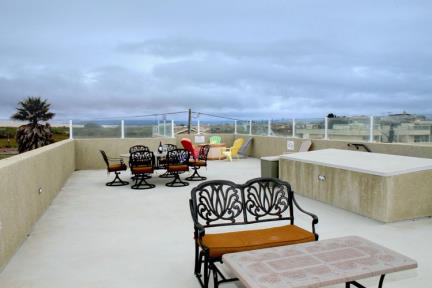 Rooftop deck includes a gas grill and plenty of space for entertaining.